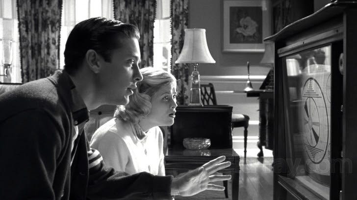 Characters from the movie Pleasantville look at a TV.