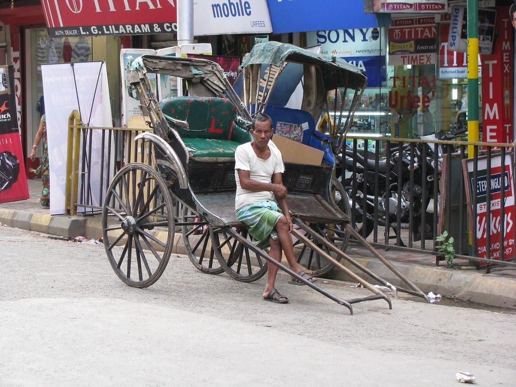 Human powered rickshaw | A rickshaw puller waits for passeng… | Flickr