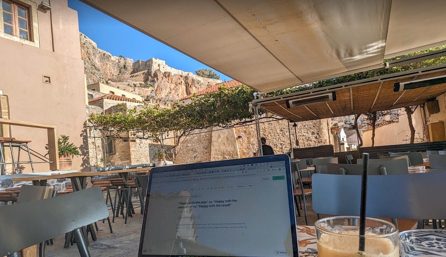 Photo from a cafe in Monemvasia with a laptop showing this article