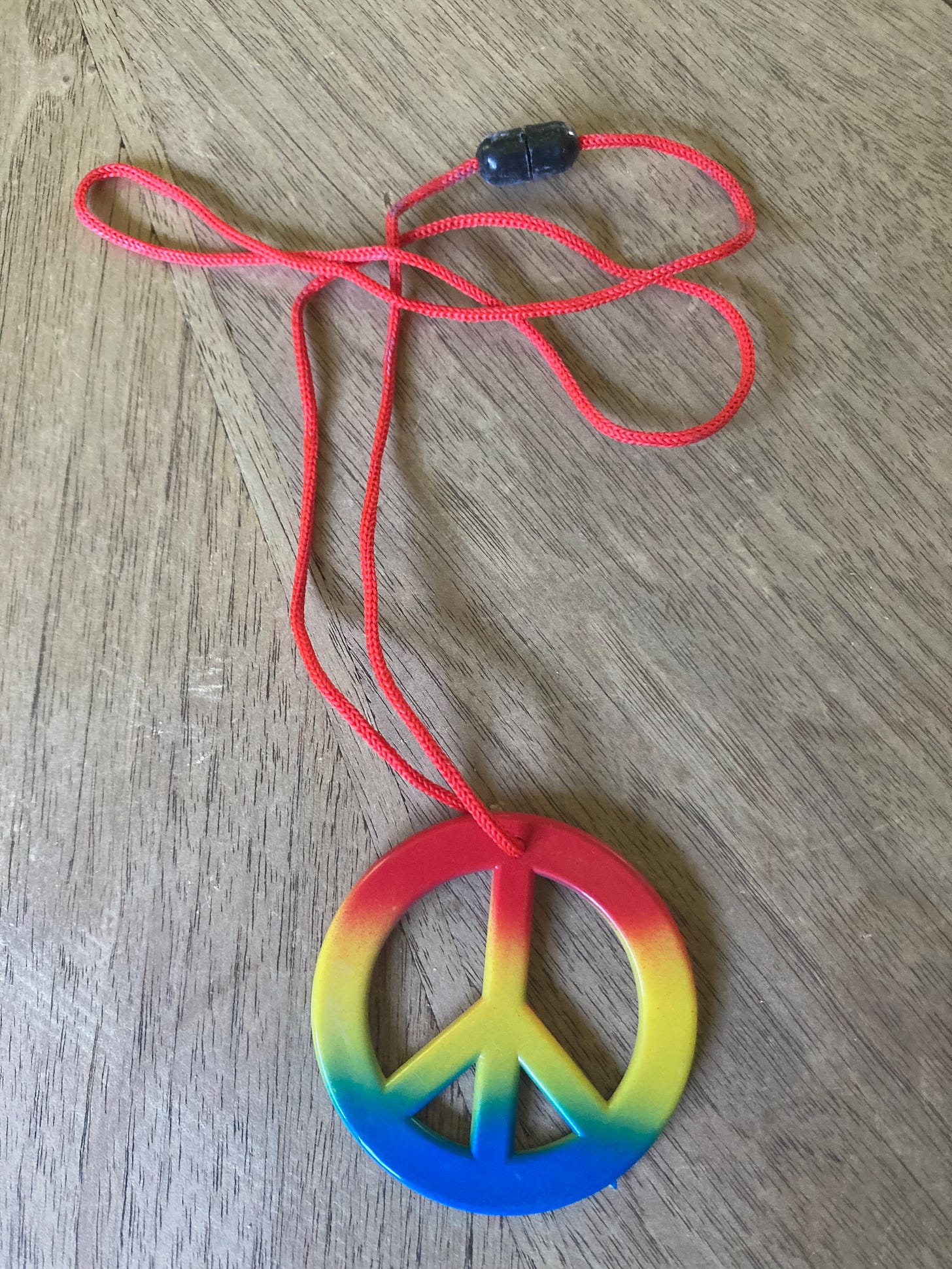 Necklace with a rainbow peace sign