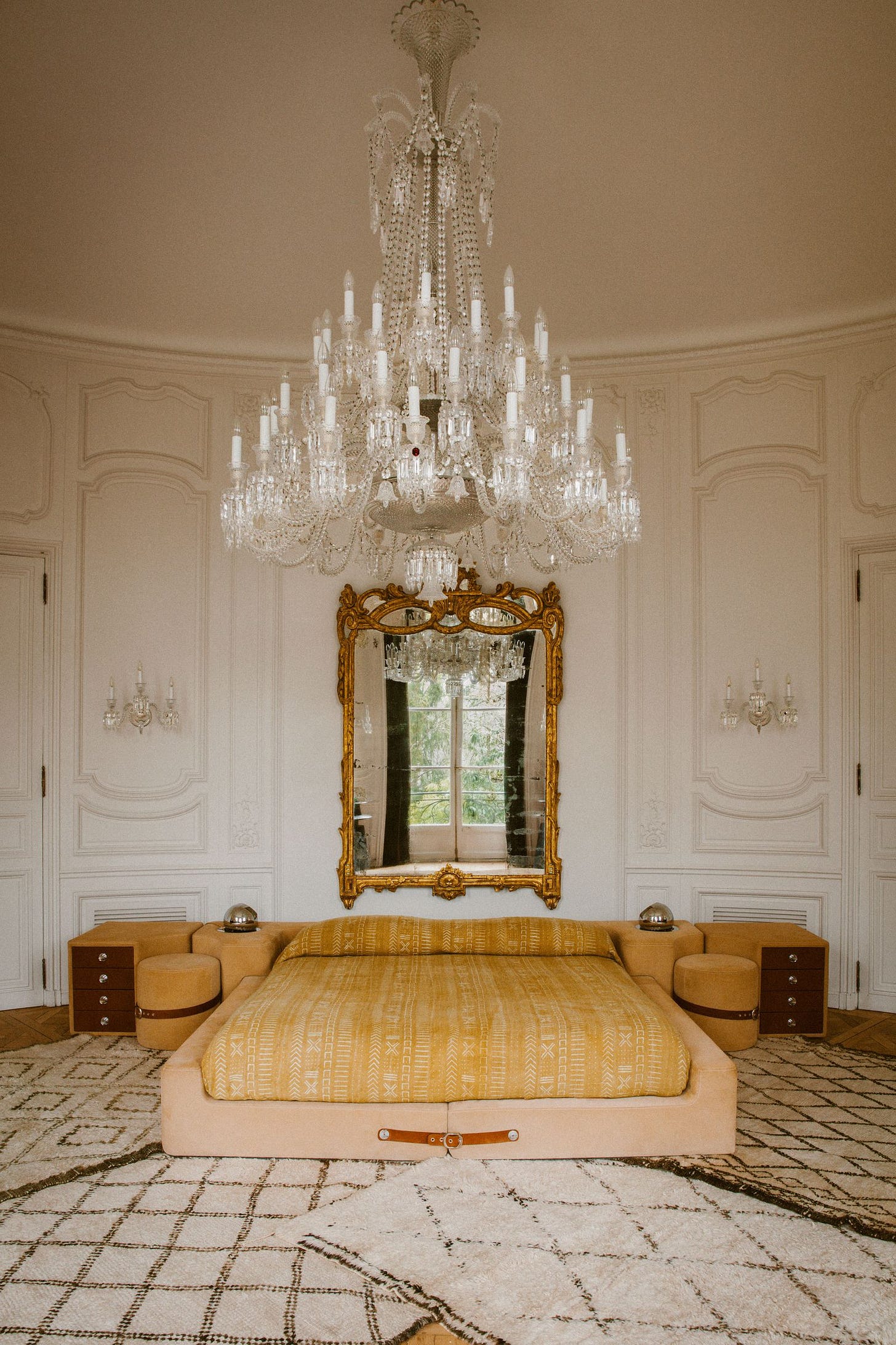 Image may contain Chandelier Lamp Bed Furniture Home Decor Indoors Interior Design Bedroom and Room