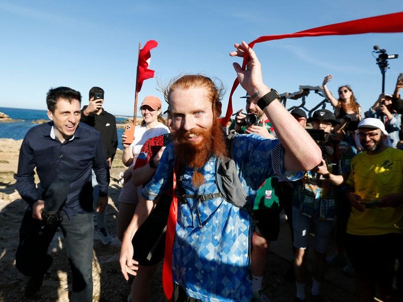 A British man who calls himself the "Hardest Geezer" has finished running  the length of Africa after a gruelling challenge that has taken nearly a  year.