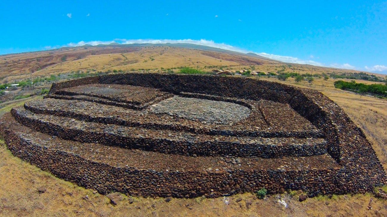 Ruins of ancient Hawaiian temple made with what looks like volcanic rocks.
