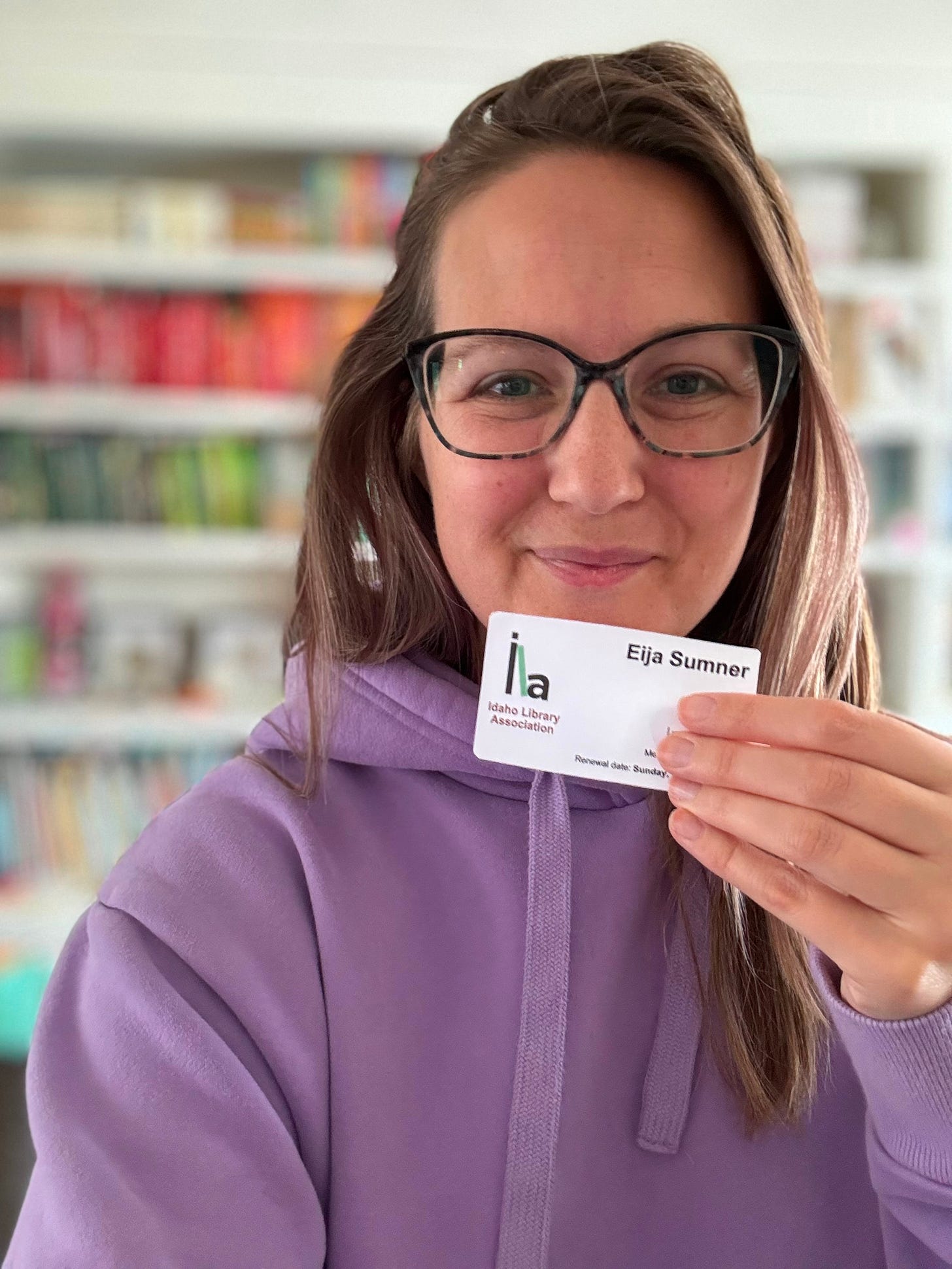 Eija posing with her Idaho Library Association card.