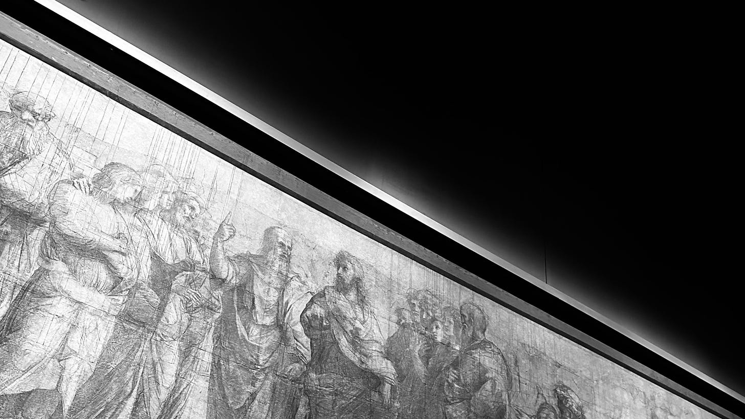 Per ChatGPT: Black and white photograph of a preparatory cartoon for Raphael's "The School of Athens." The image, viewed from a low angle, shows detailed sketches of figures in classical attire engaged in discussion. The cartoon fills the lower left diagonal half of the frame, while the upper right diagonal half shows a dark background. Strong lighting highlights the intricate pencil lines and shading, creating a dramatic contrast against the dark upper half. The perspective emphasizes the depth and detail of the drawing, capturing the essence of Raphael's preparatory work for the iconic fresco.