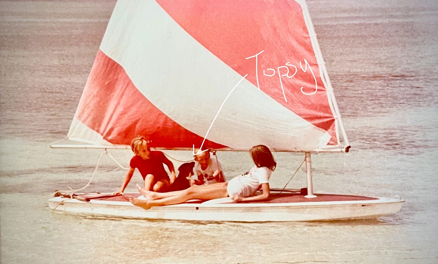 3 children sailing in nassau bahamas with a dog