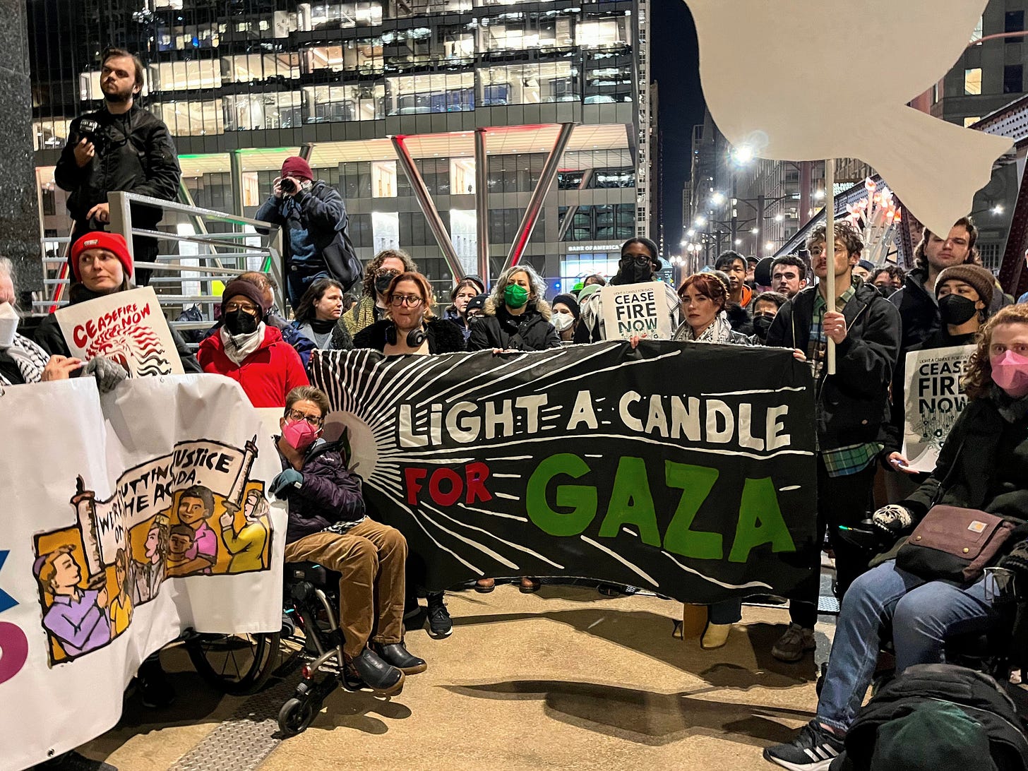 Protesters hold a banner that reads "Light a Candle for Gaza) outside the Boeing building in Chicago.