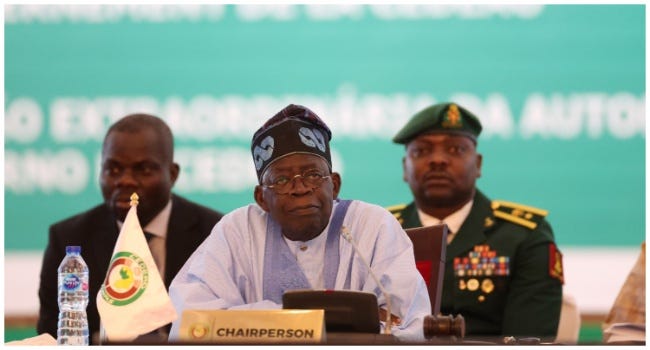 Chairperson of Economic Community of West African States (ECOWAS) and President of Nigeria, Bola Ahmed Tinubu, reacts while addressing the ECOWAS head of states and government in Abuja on July 30, 2023. (Photo by Kola SULAIMON / AFP)