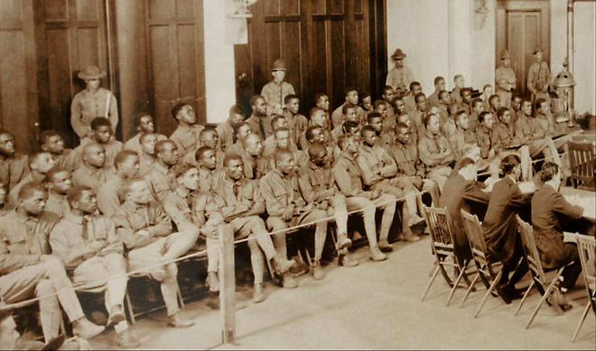 Soldiers on trial in the fall of 1917 sit under guard at Fort Sam Houston. The building they were in is now known as the Gift Chapel. Two other trials were held in a different building, a gymnasium, in 1918. Photo courtesy of the U.S. Army