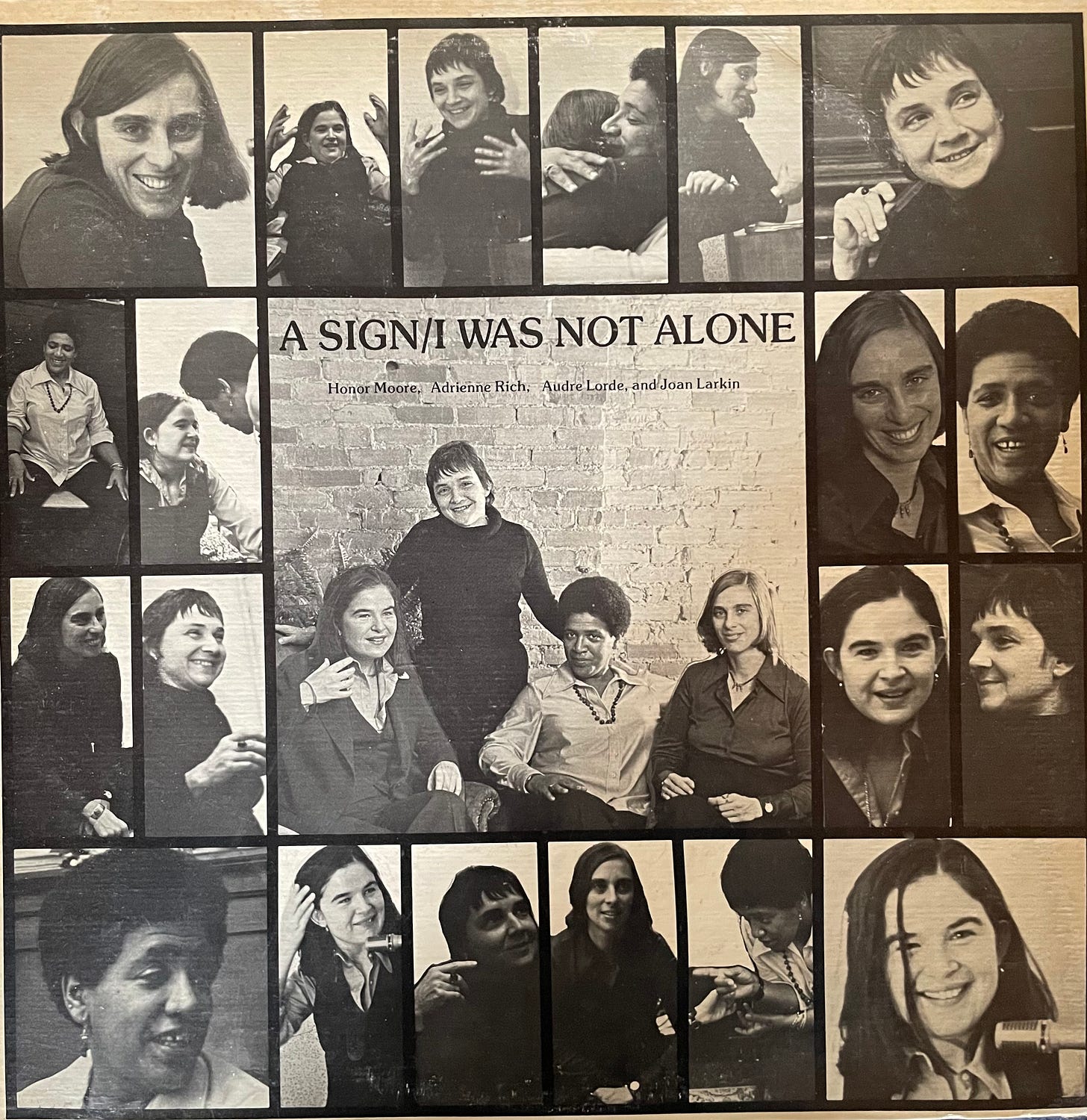An album cover titled, "A Sign/I was Not Alone," with numerous joyous photos of the poets, individually and together, gesturing, huging one another; these brim a central photograph of all four in which Adrienne Rich stands behind Honor Moore and Audre Lorde who are seated next to Joan Larkin. 