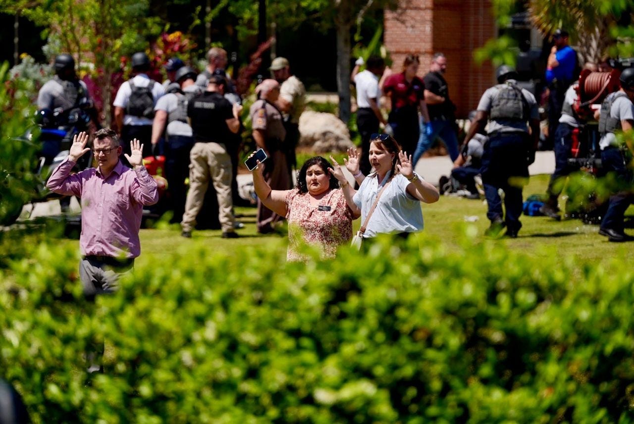 People are escorted from the Florida State Campus in Tallahassee, Florida, following a shooting on Thursday.