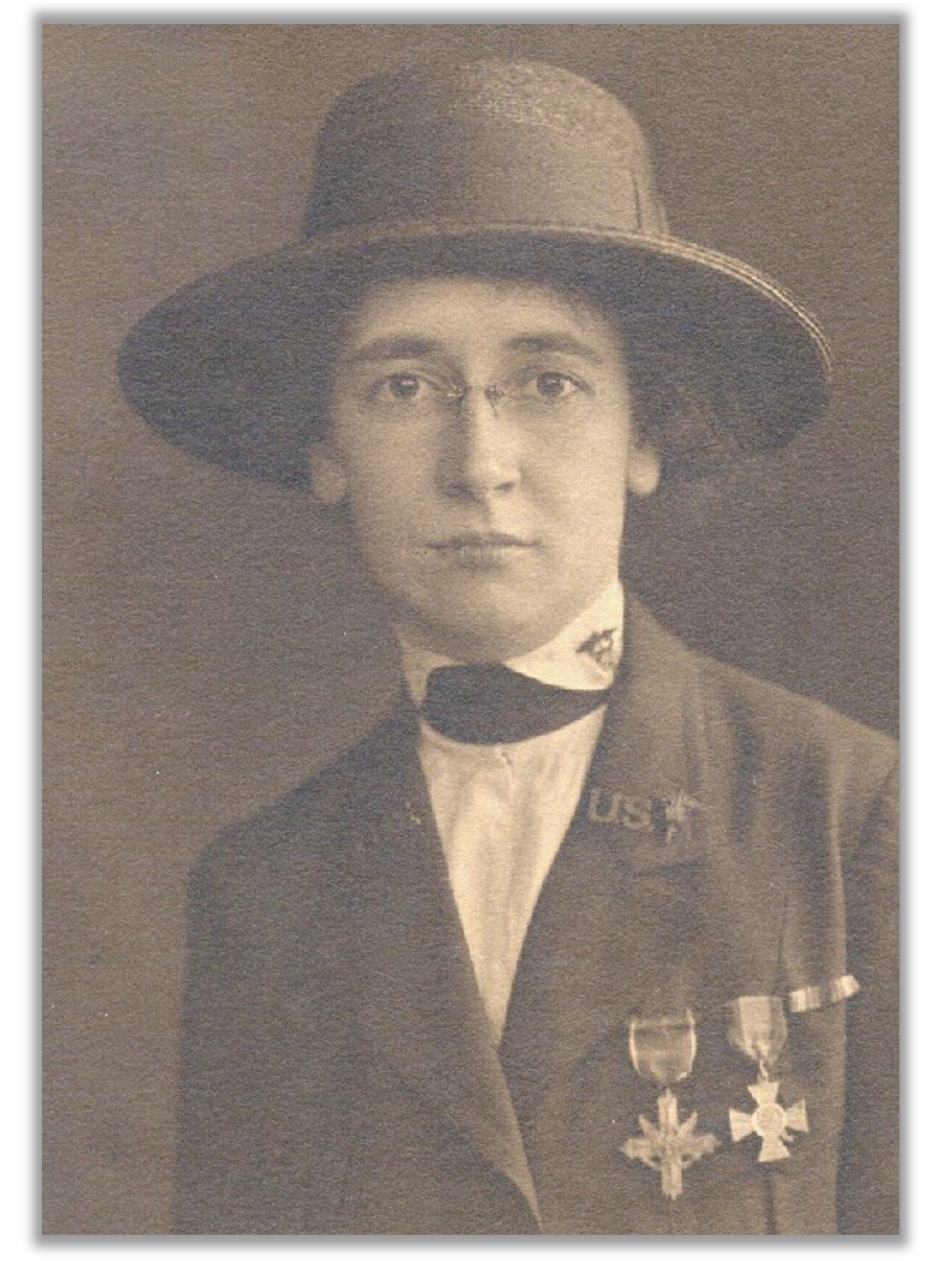 Headshot of Helen Grace McClelland in her World War I uniform.  Her Medals are attached to her jacket.