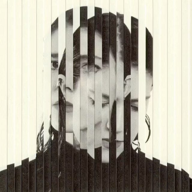This may contain: a black and white photo of two women with their faces obscured by strips of wood