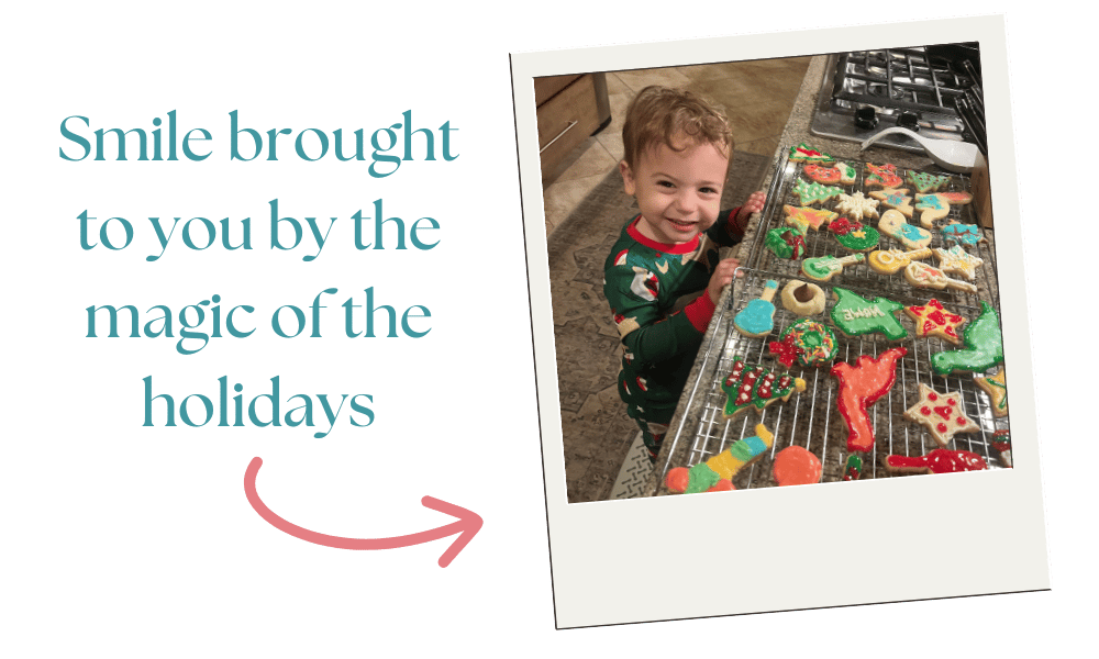 a boy smiling at the camera standing in front of Christmas cookies he decorated a boy smiling at the camera standing in front of Christmas cookies he decorated