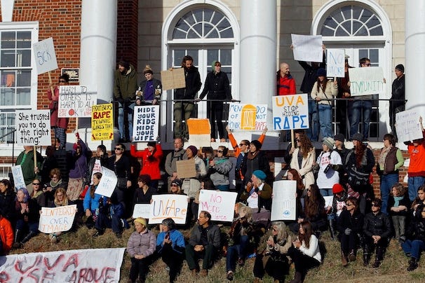 A group of people holding signs

Description automatically generated with medium confidence