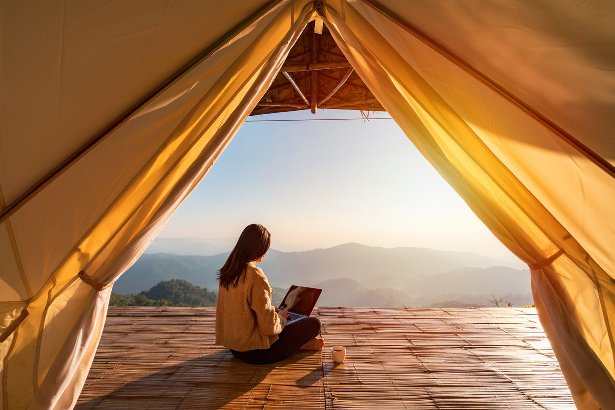 woman writing with a view