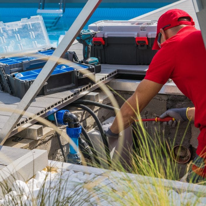 Technician Fixing Swimming Pool Heating System