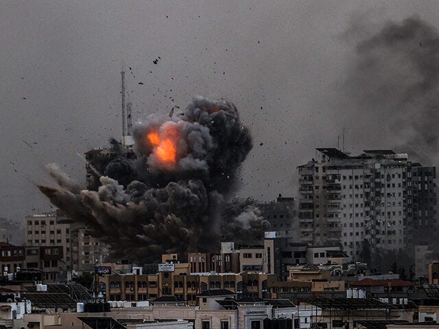 Smoke rises over the buildings as the Israeli airstrikes continue in Al-Rimal Neighbourhood of Gaza City, Gaza on October 9, 2023. (Ali Jadallah/Anadolu Agency via Getty Images)