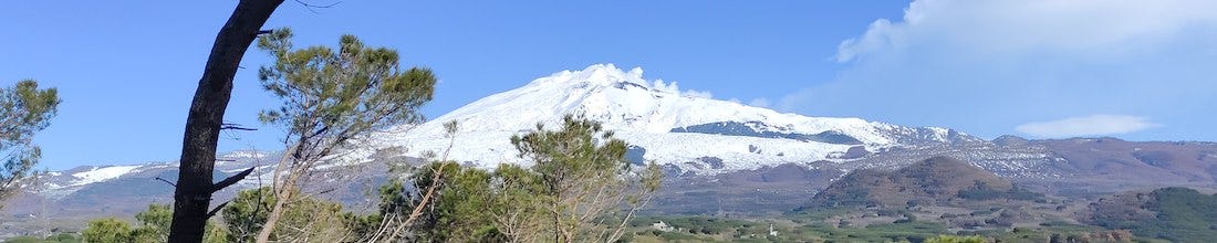 Snow-topped Mt Etna, seen from the course