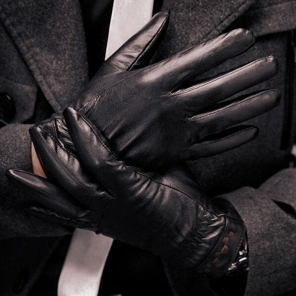A person wearing black gloves

Description automatically generated