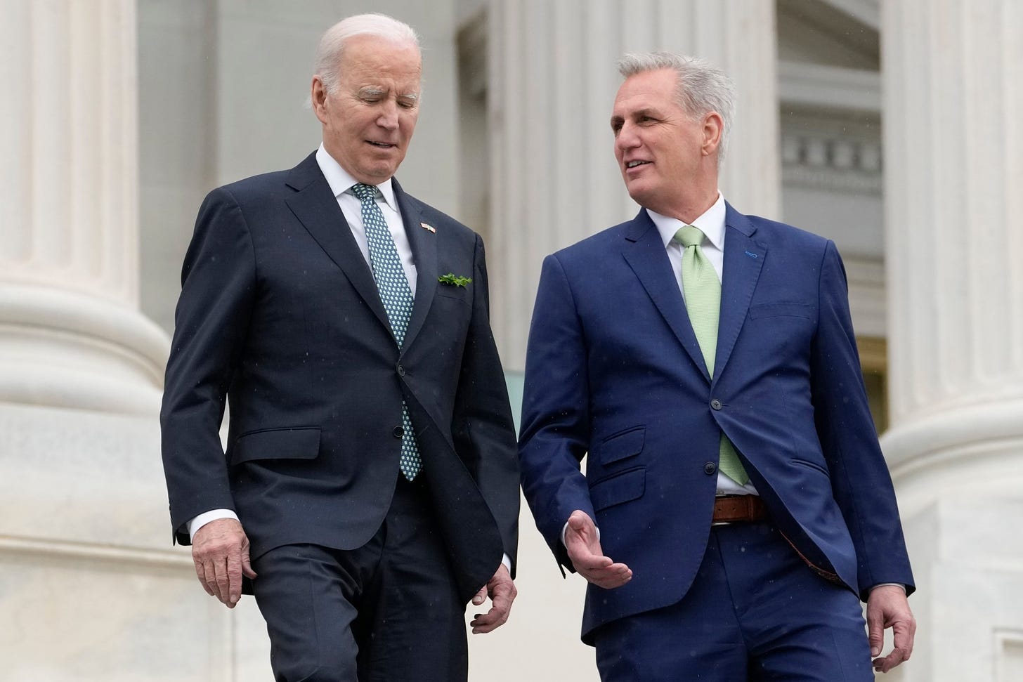 FILE - President Joe Biden talks with House Speaker Kevin McCarthy of Calif., as they walk down the House steps as they leave after attending an annual St. Patrick's Day luncheon gathering at the Capitol in Washington, March 17, 2023. The Tuesday, May 9, White House sitdown between the president and congressional leaders will be the first substantive talks between Biden and McCarthy in months, and comes weeks after House Republicans voted on a bill that would raise the debt limit but impose significant federal spending cuts. (AP Photo/Alex Brandon, File)
