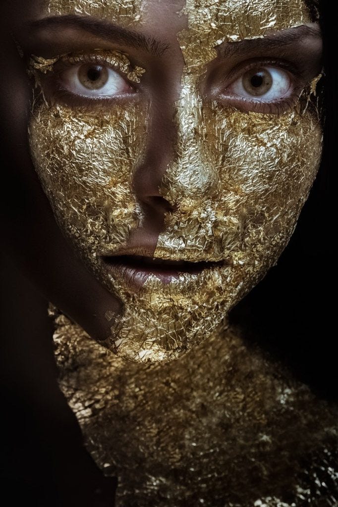 woman with gold face