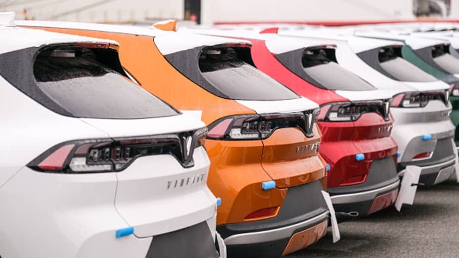 VinFast LLC's EV VF8 vehicles bound for shipment at the port in Haiphong, Vietnam, on Friday, Nov. 25, 2022. VinFast, which said in July that it had signed agreements with banks to raise at least $4 billion to help its US expansion, has about 73,000 global reservations for its EVs, according to the company. It has secured about $1.2 billion in incentives for its planned EV factory in North Carolina, where it intends to start production in 2024, according to the auto manufacturer. Photographer: Linh Pham/B