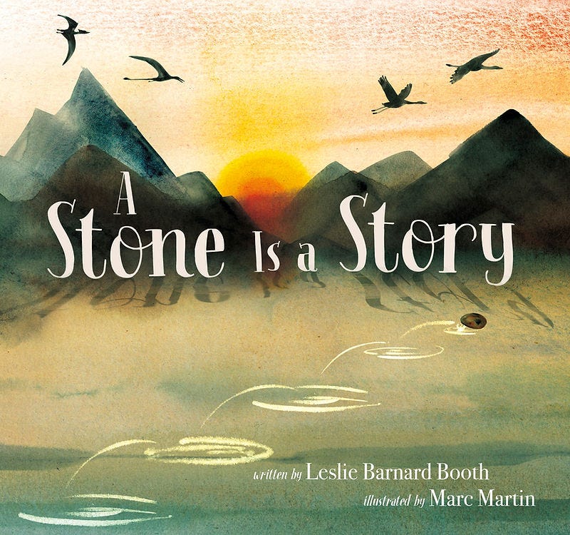 Cover of the nonfiction picture book A Stone Is a Story by Leslie Barnard Booth, illustrated by Marc Martin. Sunset scene with dinosaurs, birds, mountains, and a rock skipping across water.