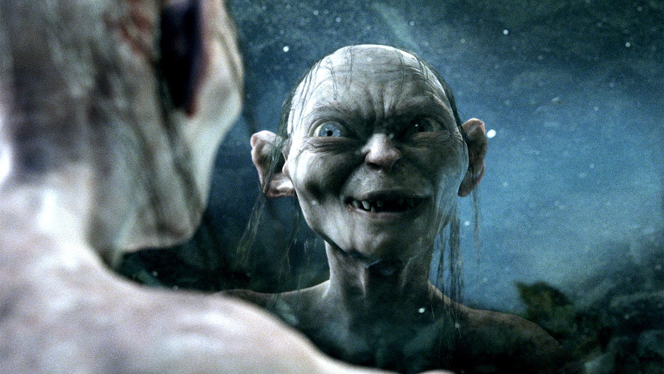 Gollum looking into a pool and seeing his reflection
