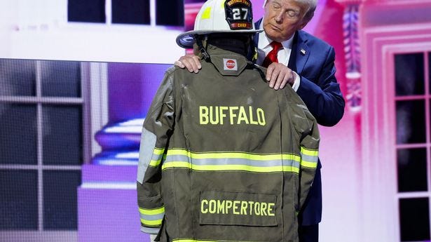 Trump poses with uniform of firefighter killed at rally with misspelled  name on jacket - The Mirror US