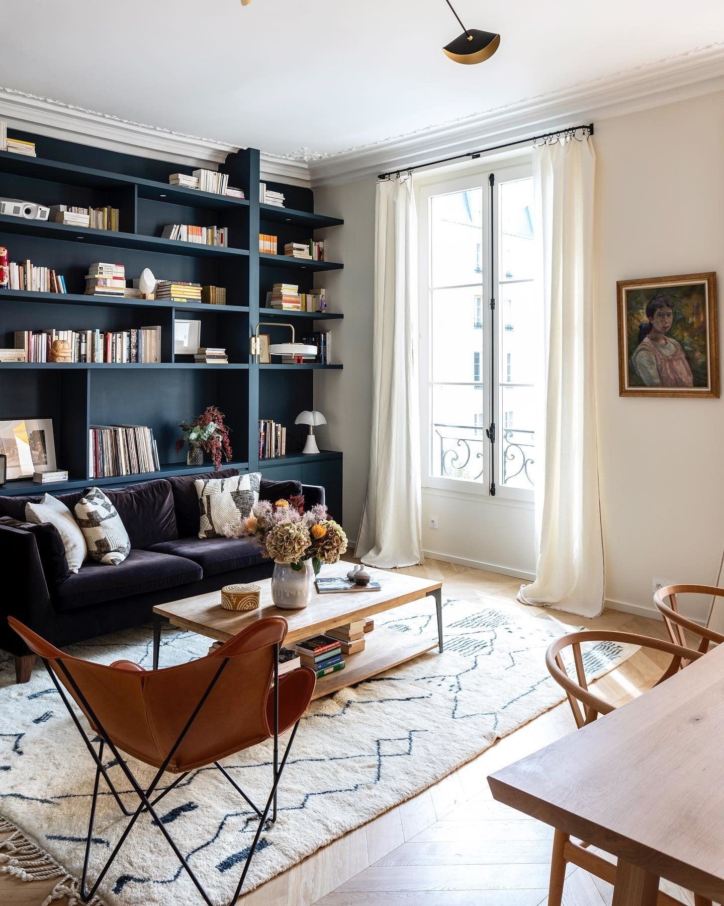 image by advanessafaivre containing living room, bookcase, couch, bookshelf, table