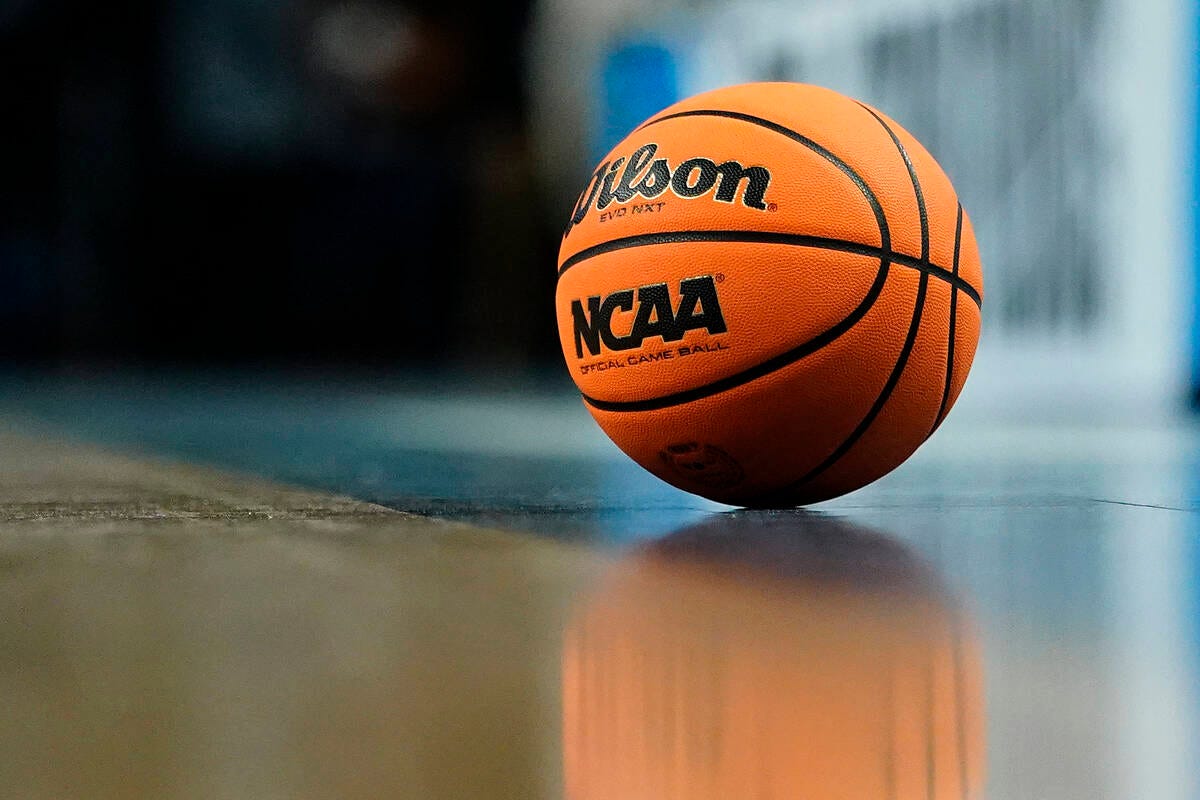 A game ball sits on the floor during a break in play of a college basketball  game between Arkan … | Las Vegas Review-Journal