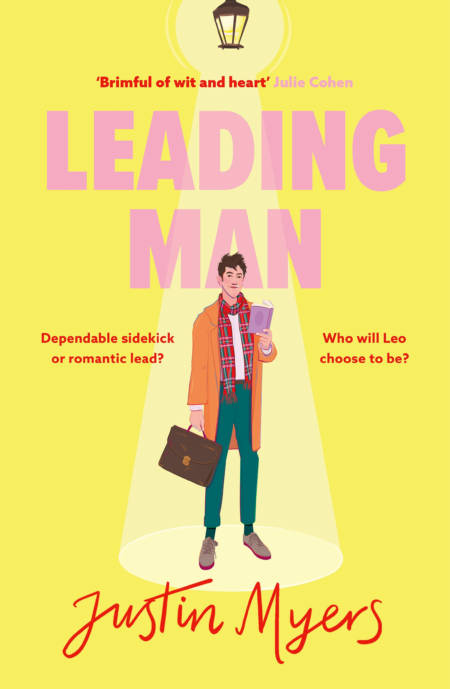 The cover of my novel LEADING MAN, which features the main character in a Mac and tartan scarf, carrying a briefcase and holding a book