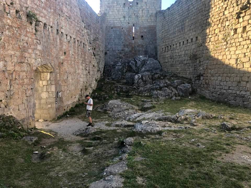 May be an image of 1 person and castle