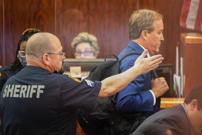 Texas Attorney General Ken Paxton leaves the courtroom after appearing for the eight-year-old felony securities fraud case against him at Harris County Courthouse on Aug. 3, 2023, in Houston.