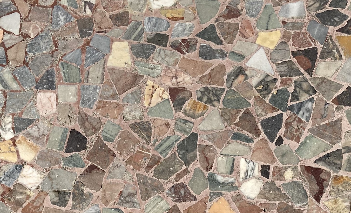 Multicoloured marble pieces embedded in a path