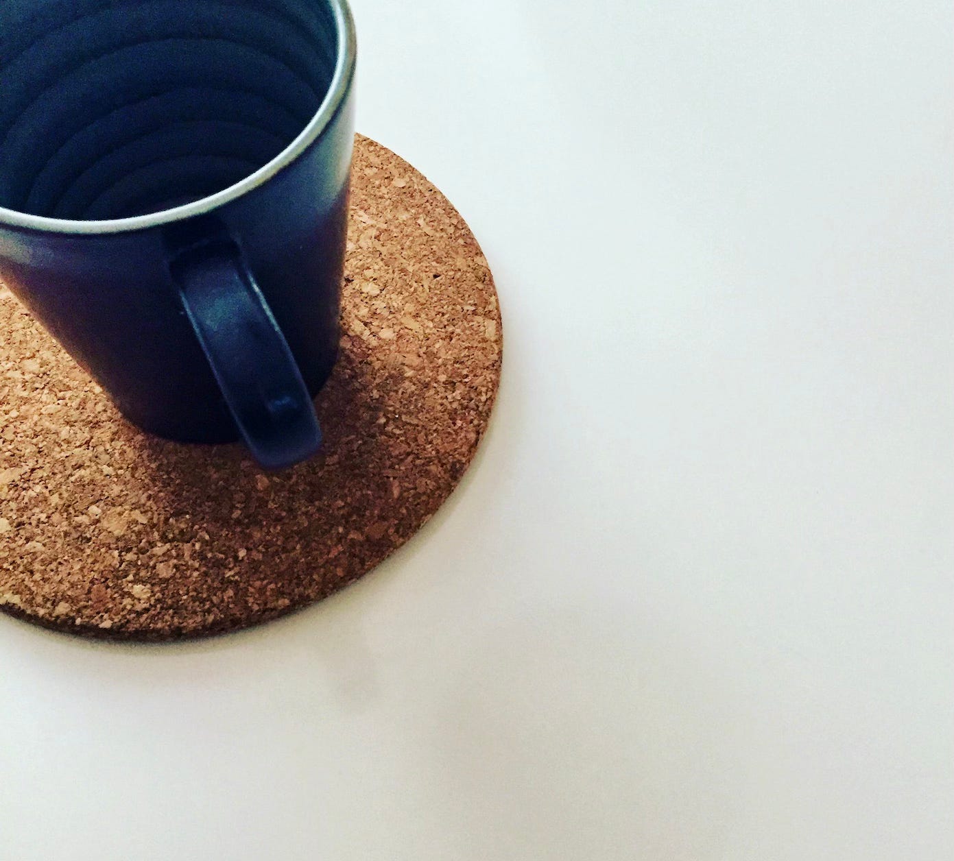 coffee cup on cork trivet