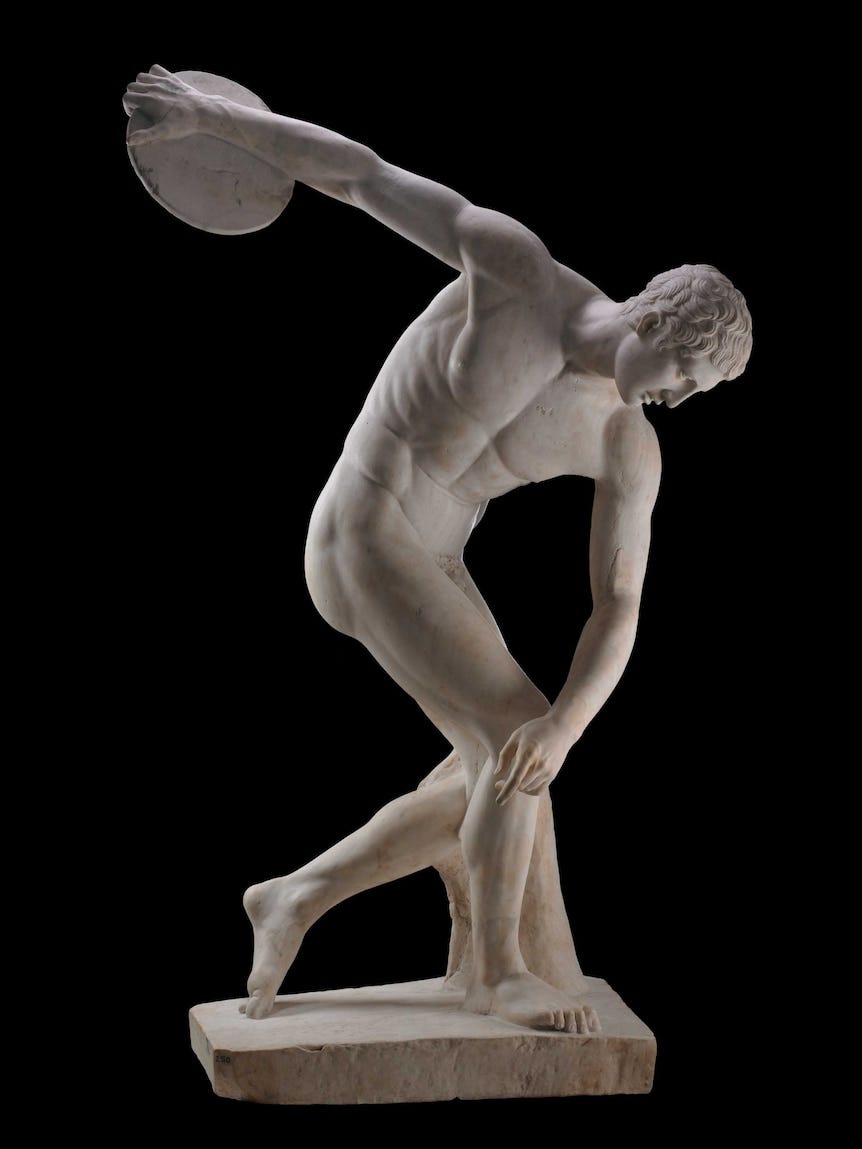 Greek sculpture of a pretty boy throwing a discus 