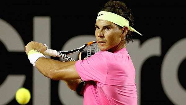 rafael nadal hitting tennis ball back to pablo cuevas rio open