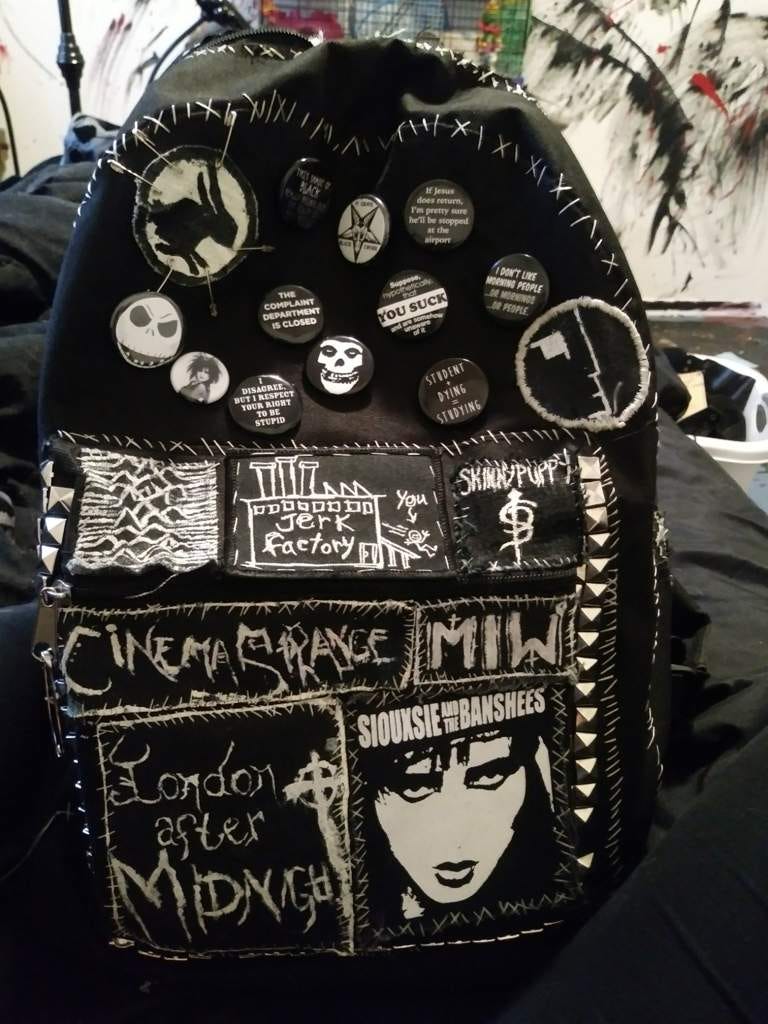 Patched up backpack-My ancient backpack that's being held together with patches, floss, pins, and questionable intentions. Mo