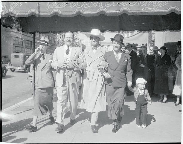 Original caption: "Wheeler and Woolsey of comedy fame set the pace by  appearing at the Hollywood 'Brown Derby' by wearing skirts. Left to right:  Robert Woolsey, Wallace Beery, Tom Mix, Bert Wheeler,