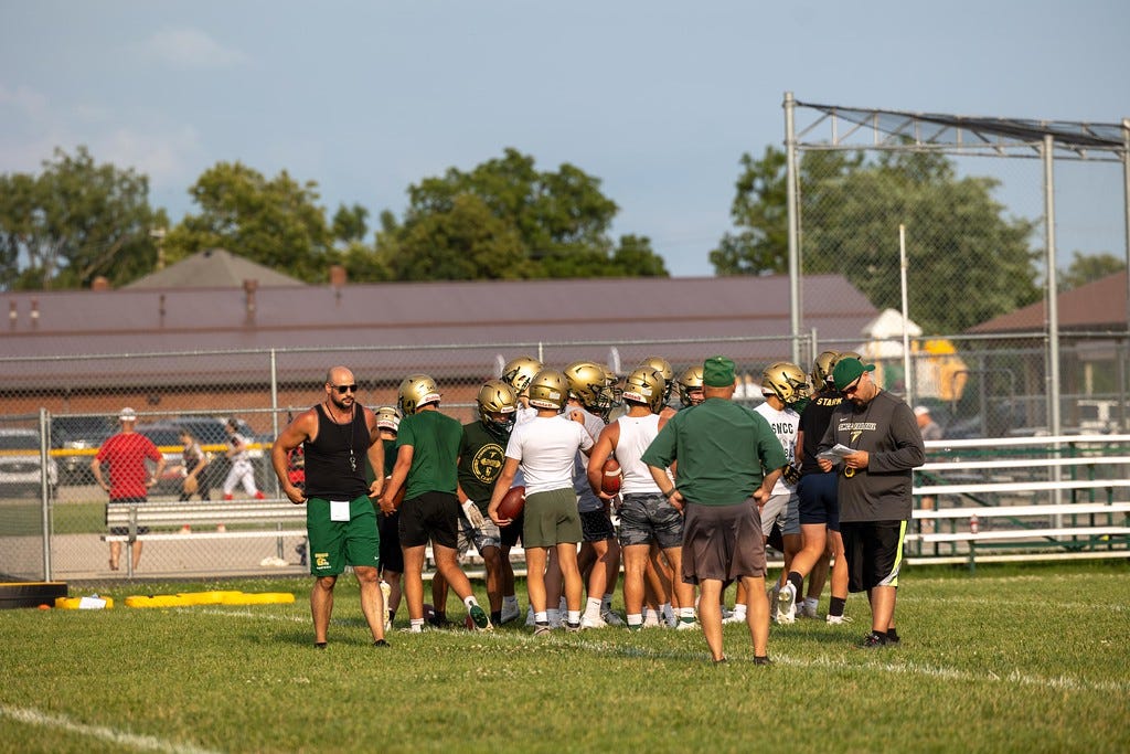 May be an image of 12 people, people playing football and text