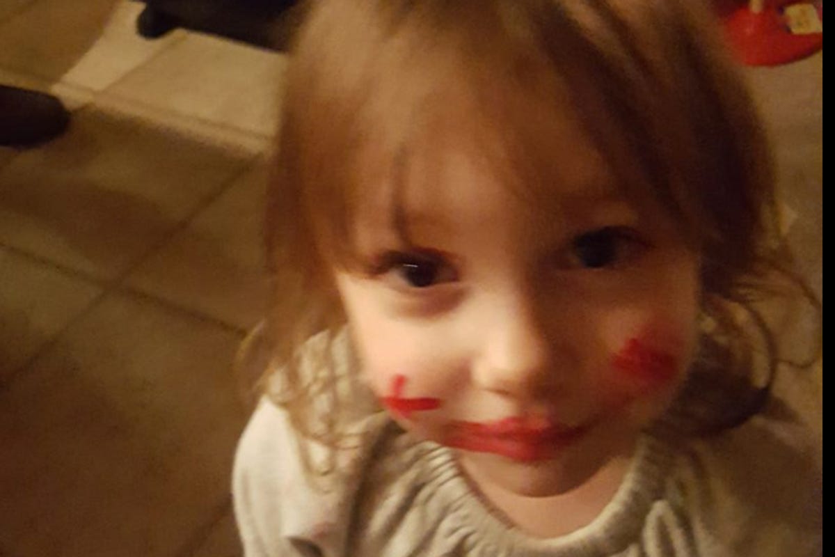 Donna Rose has x's of lipstick all over her face, she is 2 years old. 