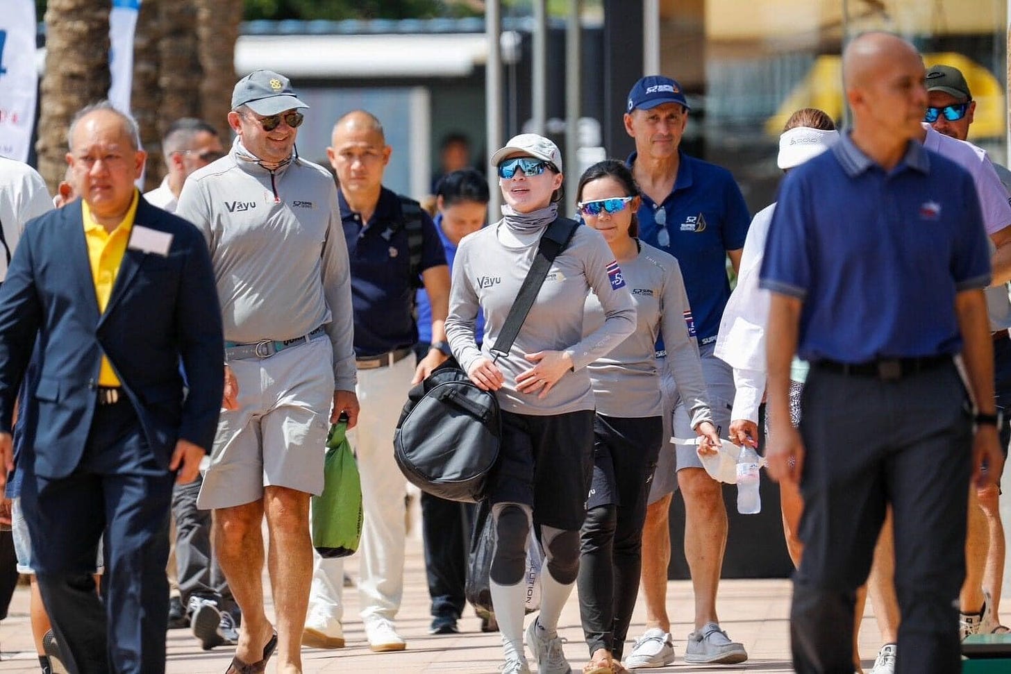 May be an image of 7 people, people playing tennis, people golfing and text