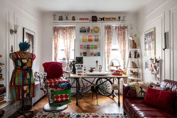 A living room filled with mementos from secondhand shops and from the street includes a barbershop chair. 