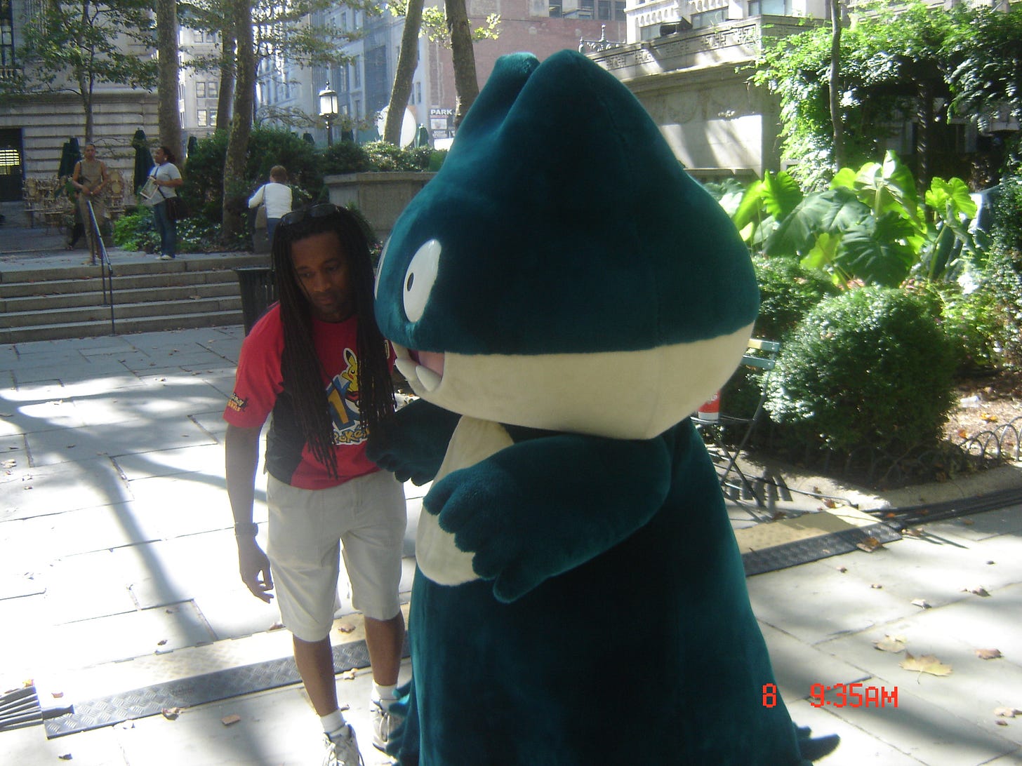 Costumed Pokémon were present in Bryant Park; this photograph shows a very happy Munchlax with a member of the staff at the event Costumed Pokémon were present in Bryant Park; this photograph shows a very happy Munchlax with a member of the staff at the event