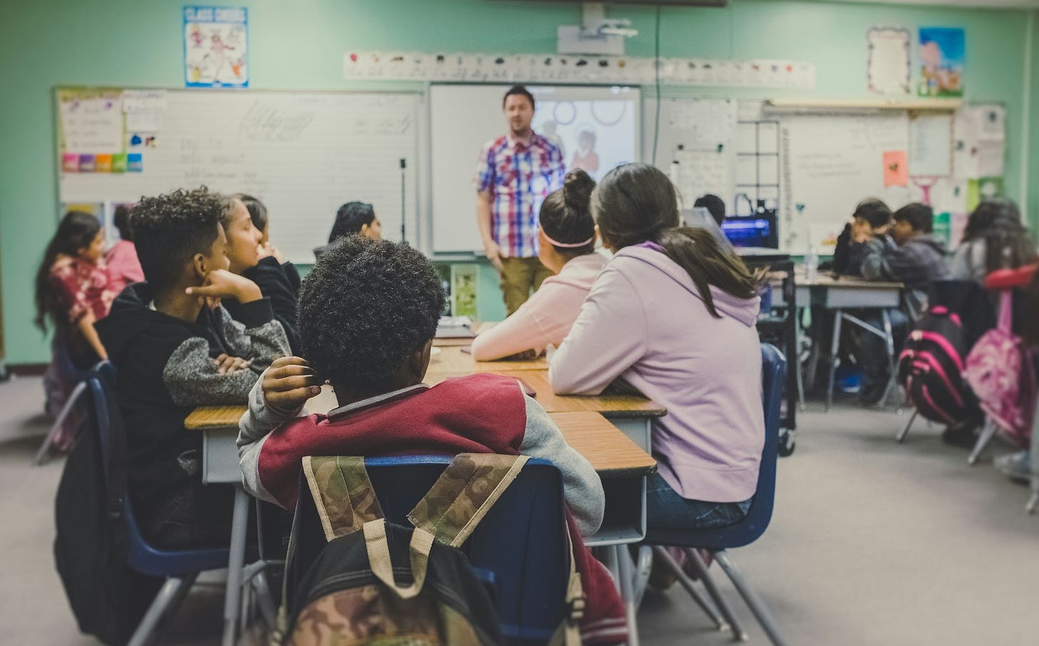 Teacher in front of students in a classroom