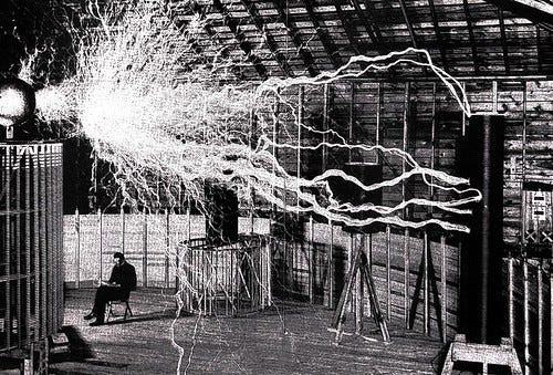 Nikola Tesla in his Colorado Springs laboratory surrounded… | Flickr