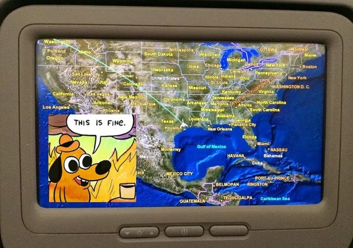An inflight map in a seatback of an airplane with the "This is Fine" dog meme sitting in the corner of the screen.