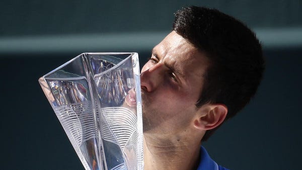 Novak Djokovic kissing 2015 miami open trophy